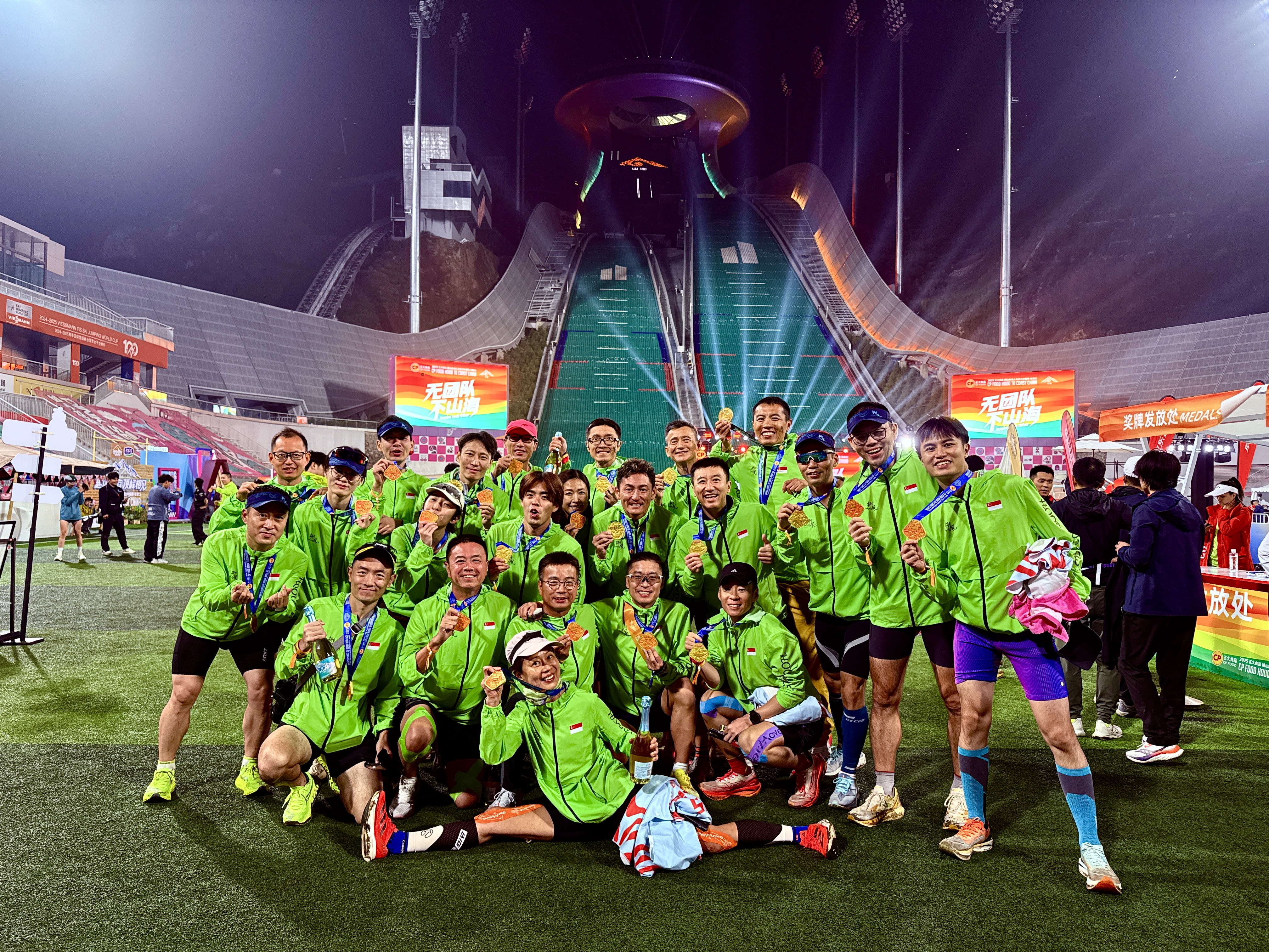 Zephyr team celebrating with medals at the finish