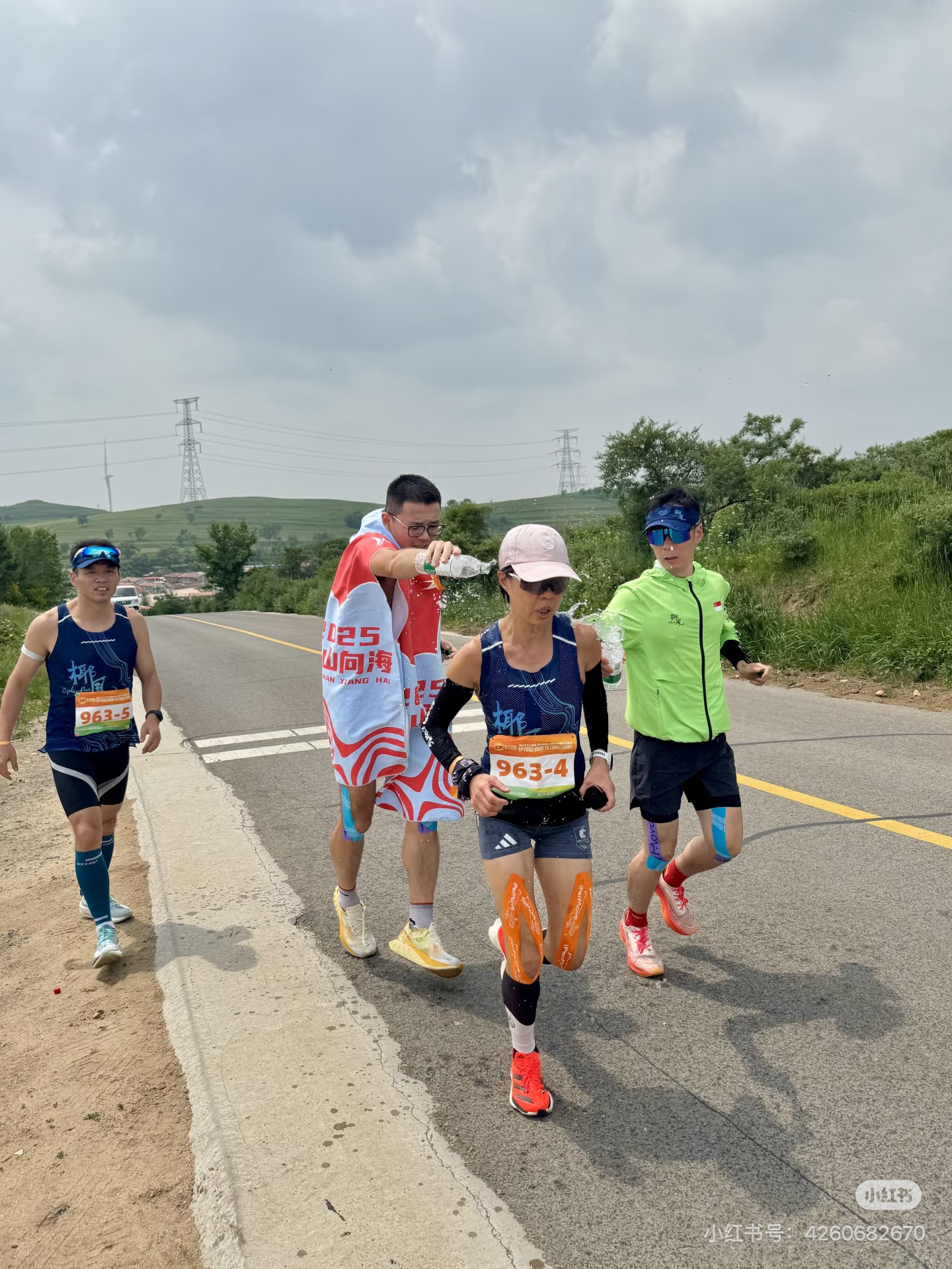 Team members supporting a runner at the relay checkpoint