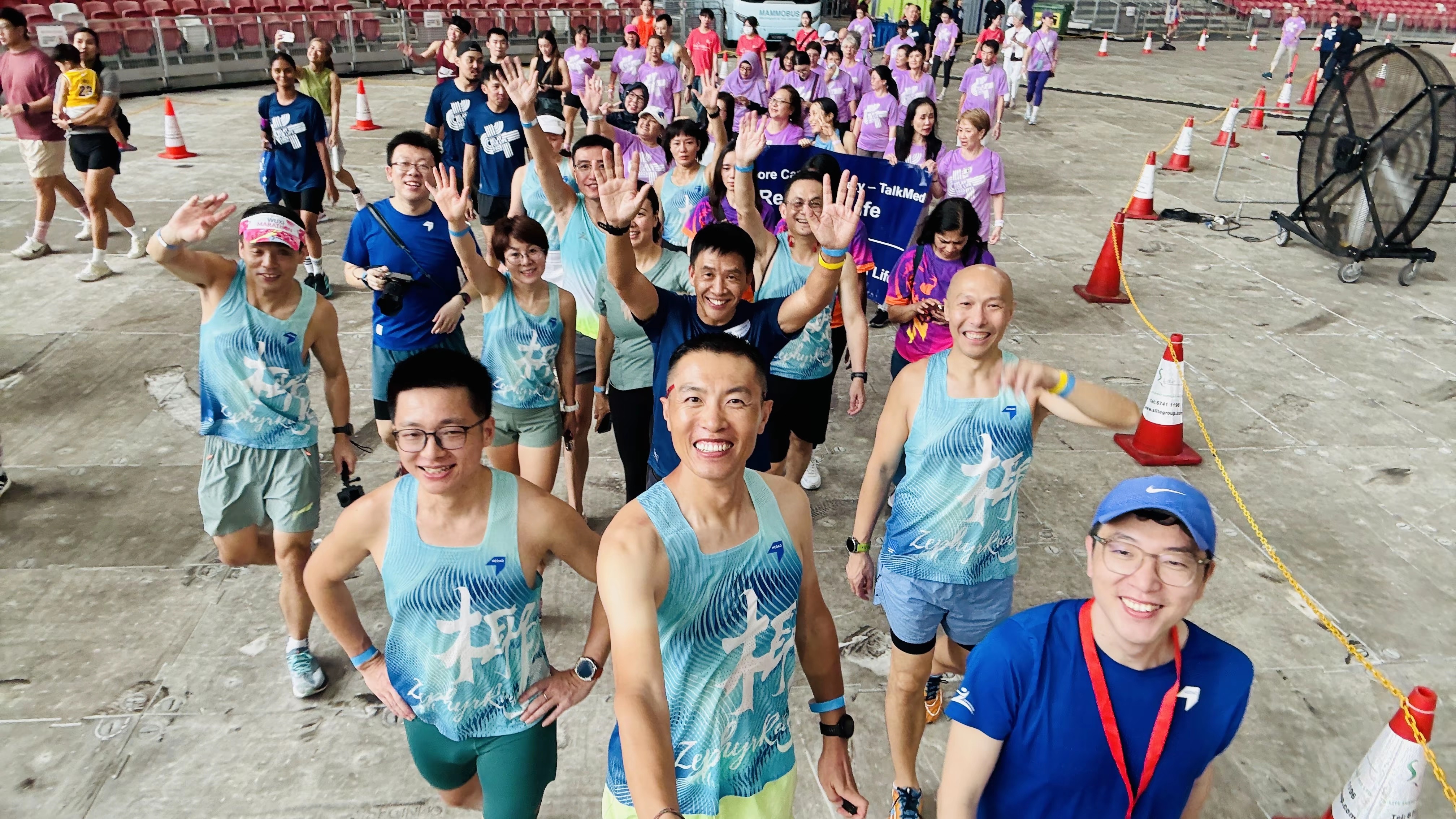 Zephyr team cheering together at Relay For Life Singapore