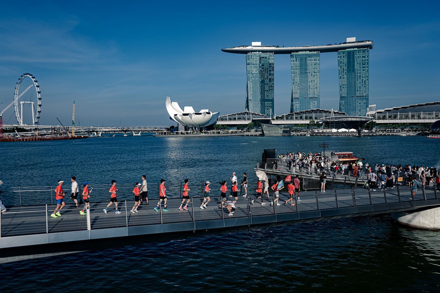 Runners against the iconic Marina Bay Sands skyline